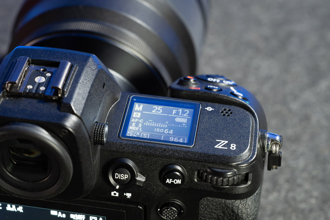 The Nikon Z8 top backlit display, lit up showing the settings.